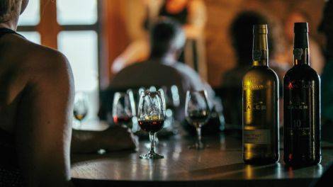 Experience a slow-paced Douro River cruise in Portugal aboard a charming wooden boat, exploring vineyard-covered hillsides and enjoying exclusive wine tastings in the heart of the Douro Valley.